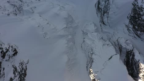 impressive aerial view of a snowy mountain in squamish, canada