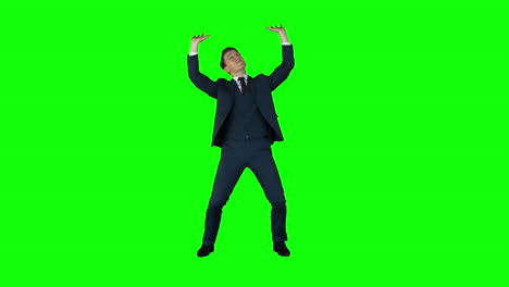 Businessman-lifting-something-on-green-screen-