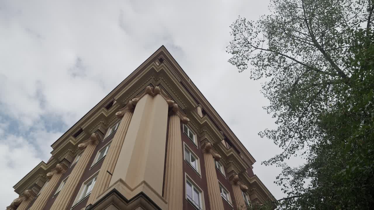 Elegant architecture of Soviet era building facade. Low angle view