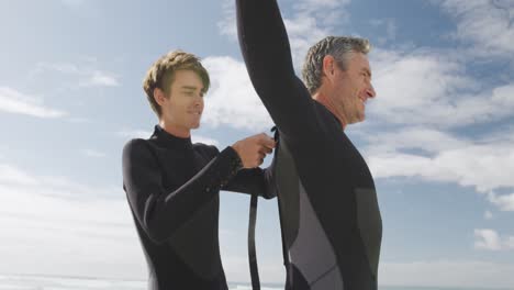 father and young adult son enjoying outdoor activities together