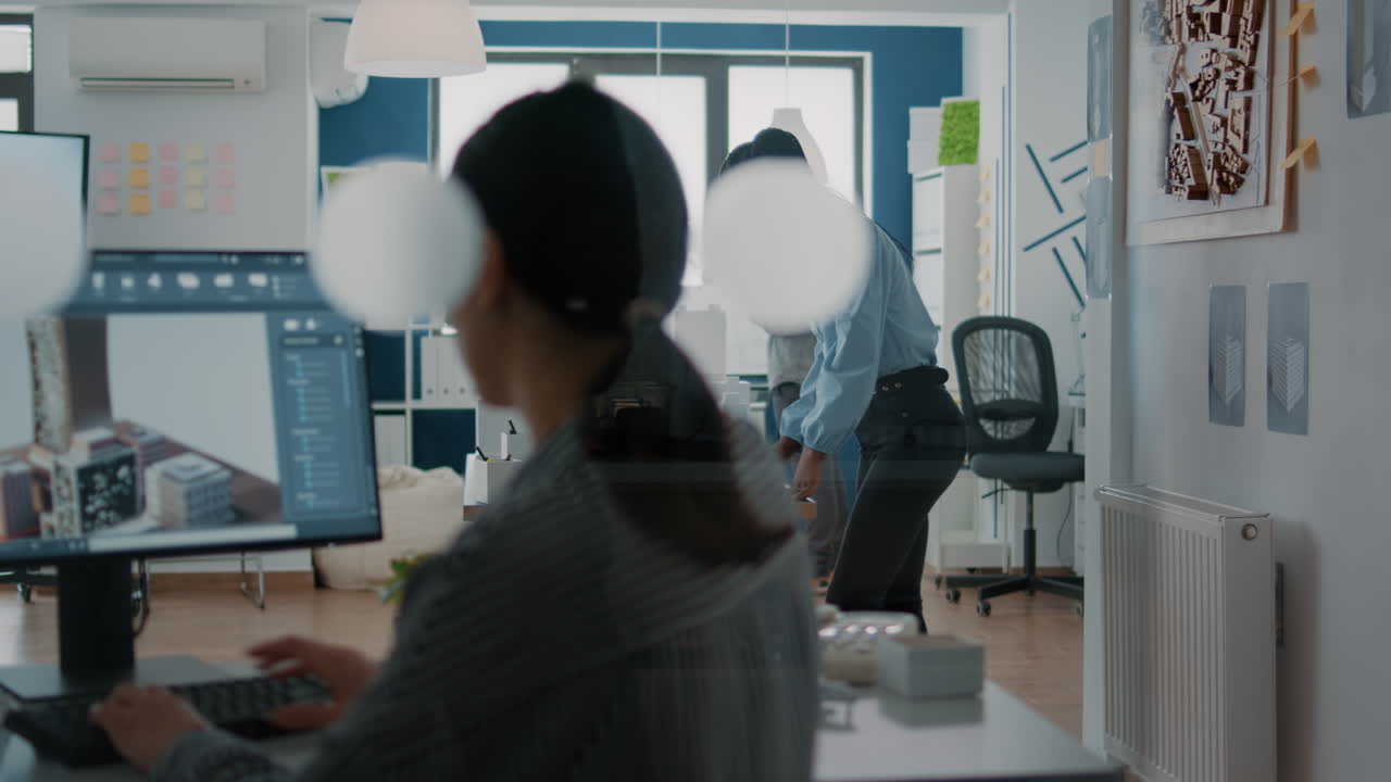 Architects working on a building model in the office