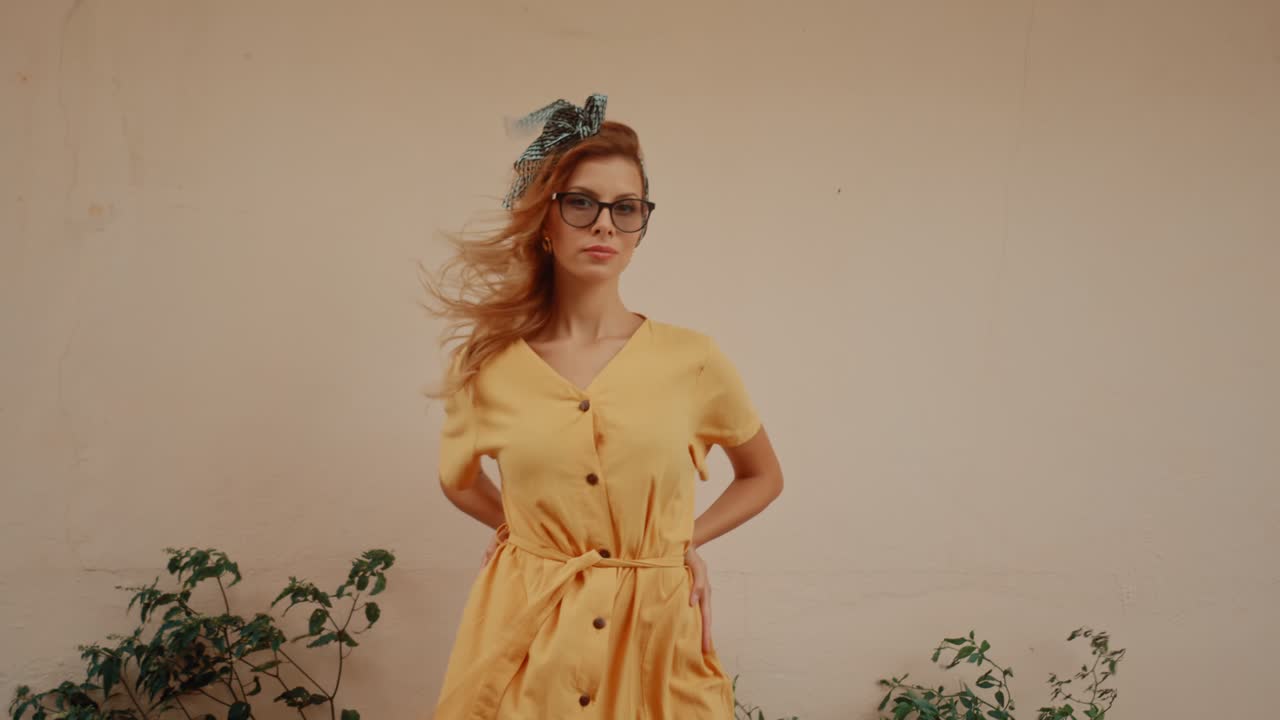 Woman in Yellow Dress and Glasses Posing Outdoors