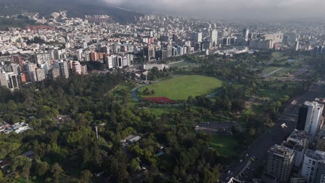 Aerial-drone-video-view-footage-of-Qutio-early-morning-sunrise-capital-city-of-Ecuador-La-Carolina-Park-traffic-Catedral-Metropolitana-de-Quito-south-american-skyline