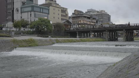 kamo river and bridge, sanjo area of kyoto, japan