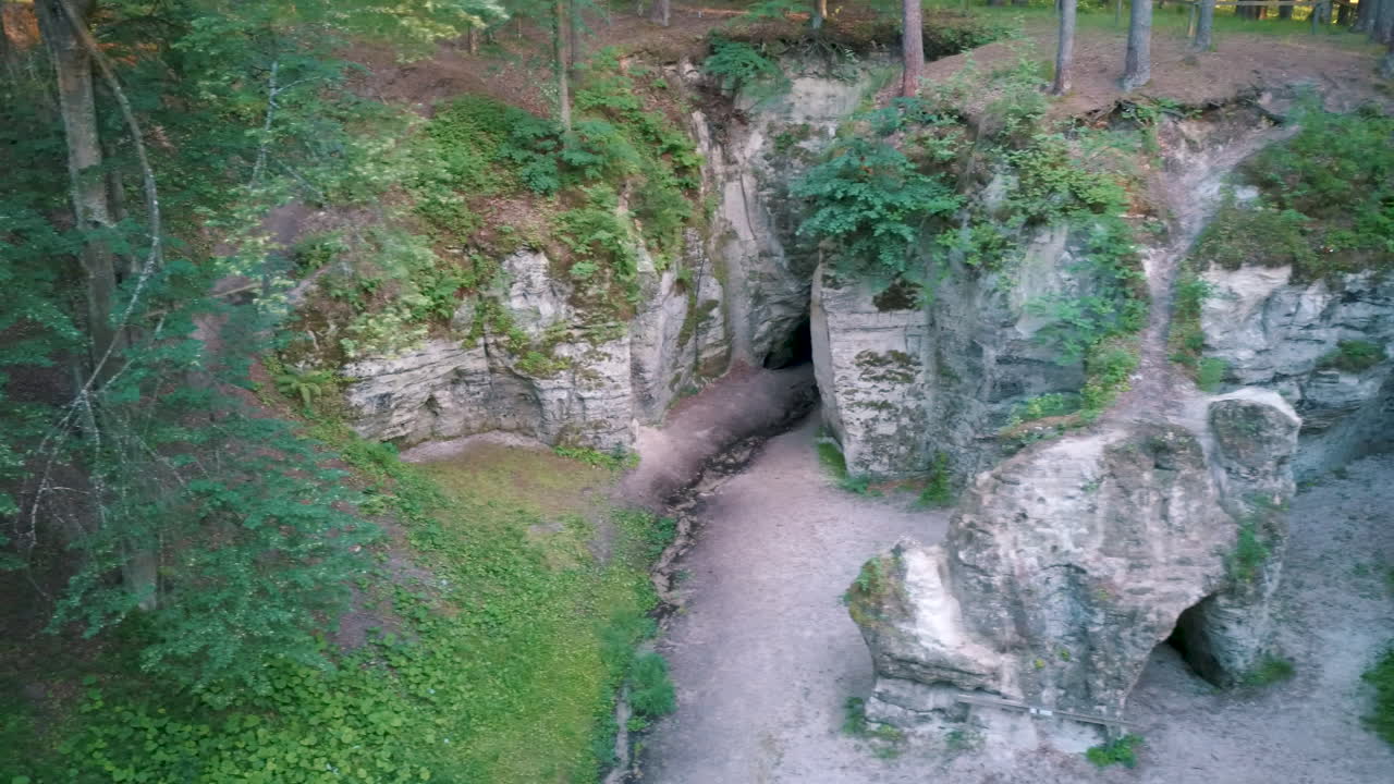 Devil's Oven or Large Ellite Natural Geological Monument  Located in the Gauja National Park at Lode Behind Cesis in Latvia. Licu – Langu Sandstone Cliffs Liepa Cave. Aerial Dron Shoot.