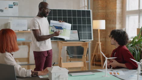 african american engineer presenting alternative energy project in office