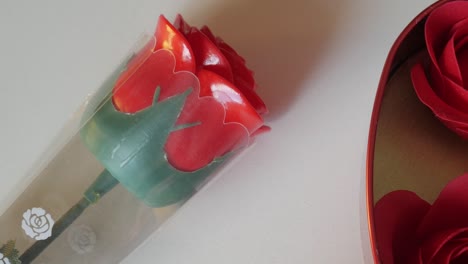 red rose in a transparent plastic with valentine's day theme, perfect for gifting