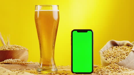 beer and mobile phone mockup with green screen