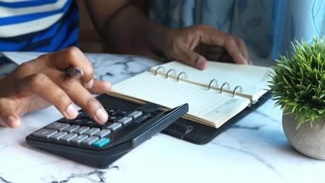 person calculating finances