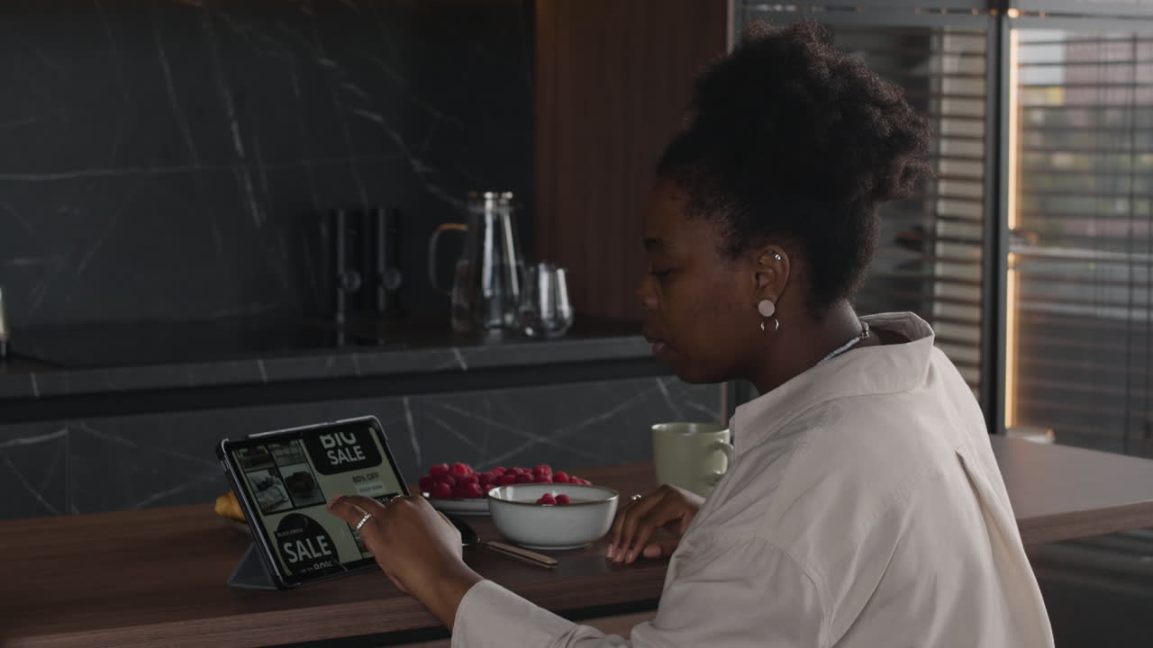 Woman online shopping on tablet