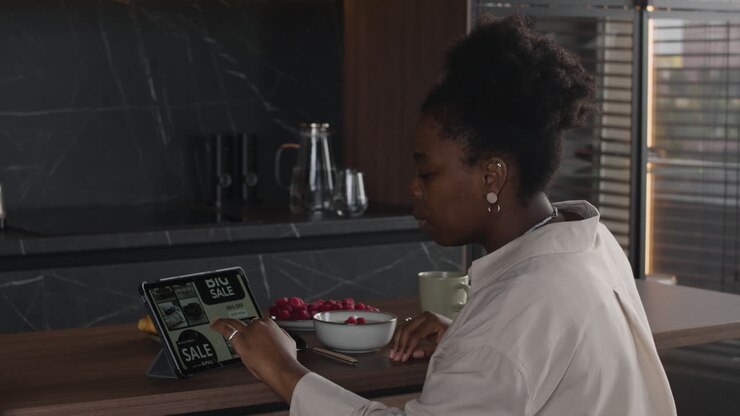 Woman online shopping on tablet