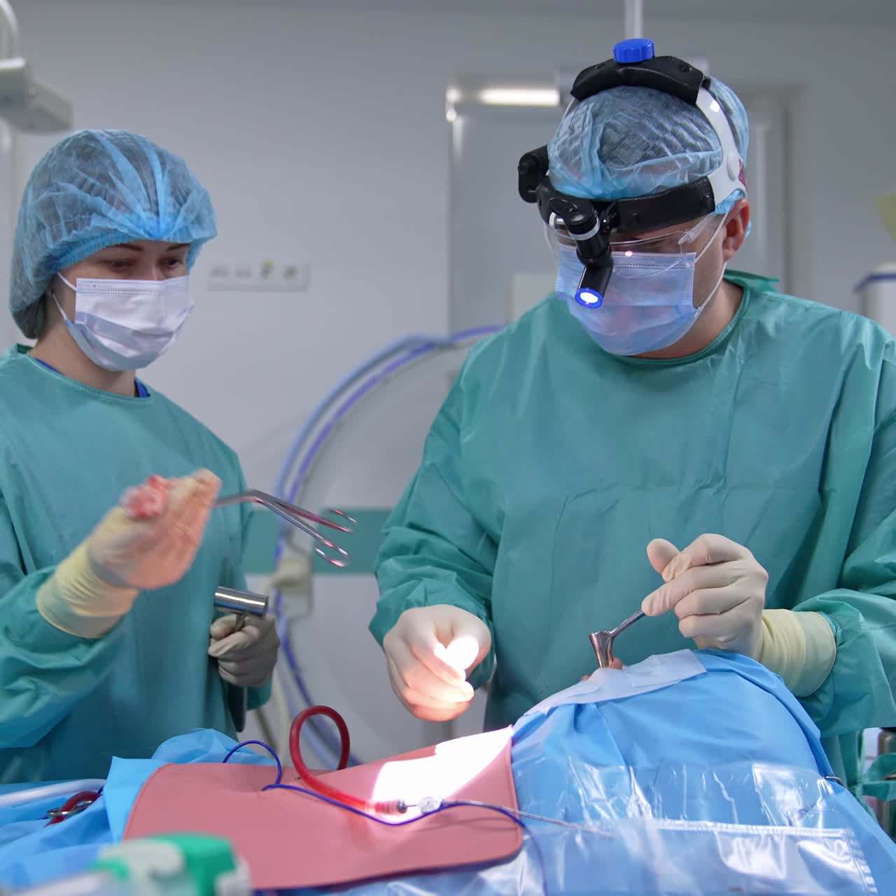 Assistant and surgeon in operating room. Professional doctor together with a nurse perform nasal surgery using sterile medical instruments