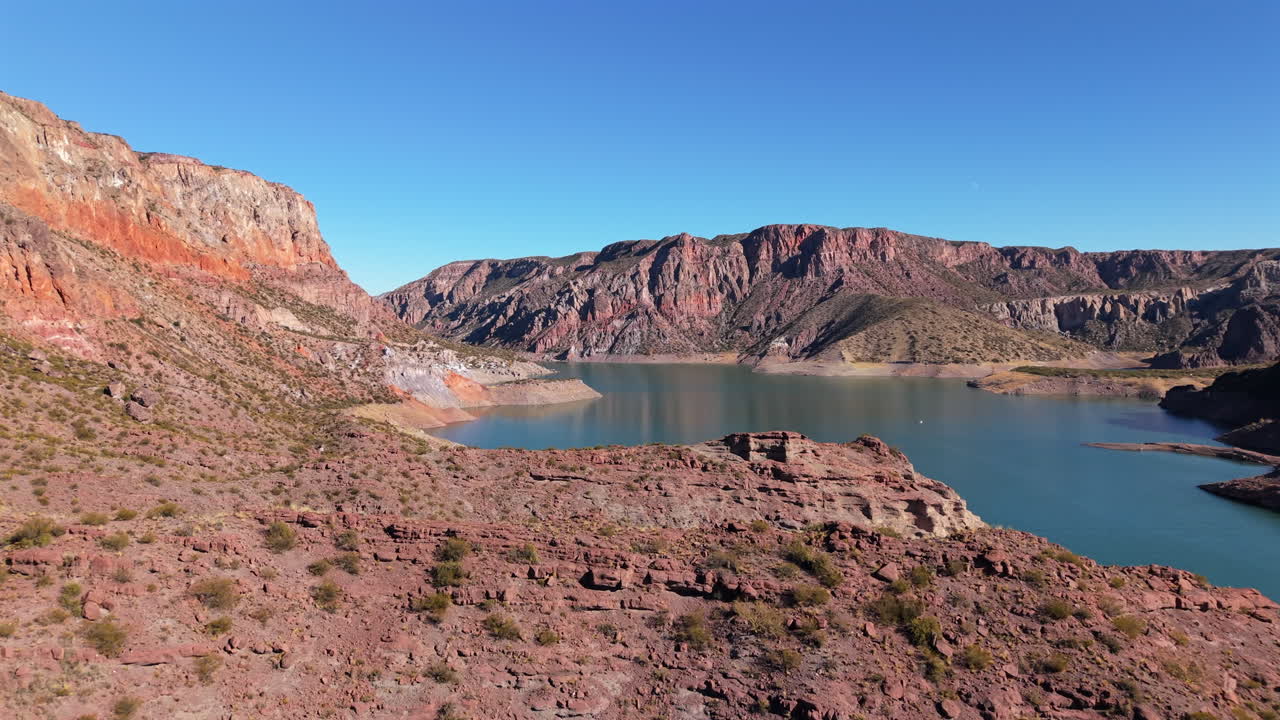 Aerial view of the majestic Atuel Canyon as popular tourist attraction surrounding calm river, San Rafael, Mendoza, Argentina.