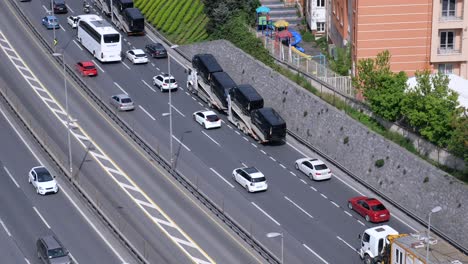 highway traffic with buses on a transport truck