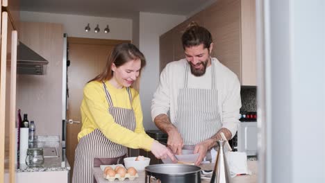 couple baking together in the kitchen