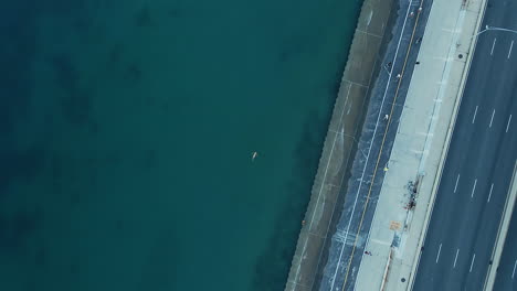 lake shore drive - top down shot of water and road in downtown chicago
