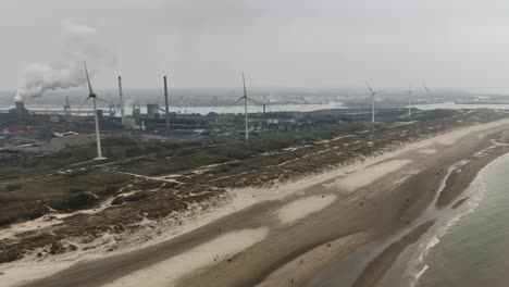 Static-aerial-view-over-Strand-Wijk-aan-Zee-of-Tata-Steel-manufacturing-plant