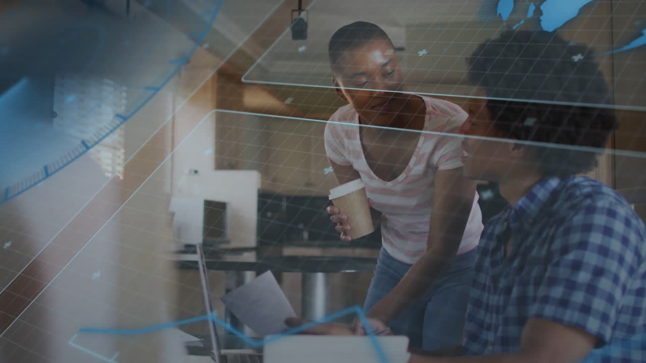 Blue map overlay fading over subjects, woman leaning over laptop, man typing, working on tech task