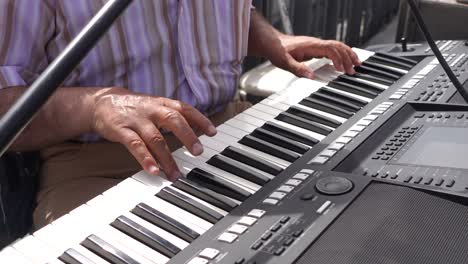 man playing electronic keyboard