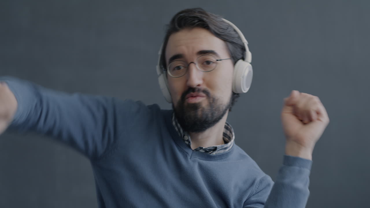 Man Dancing to Music with Headphones