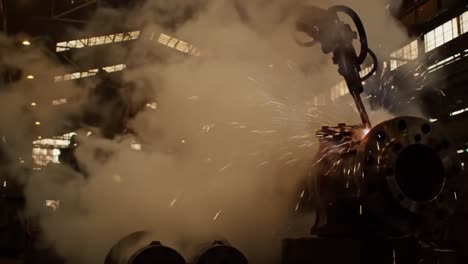 a glimpse inside the industrial workshop: steam, machinery, and metal components in action under dim lights