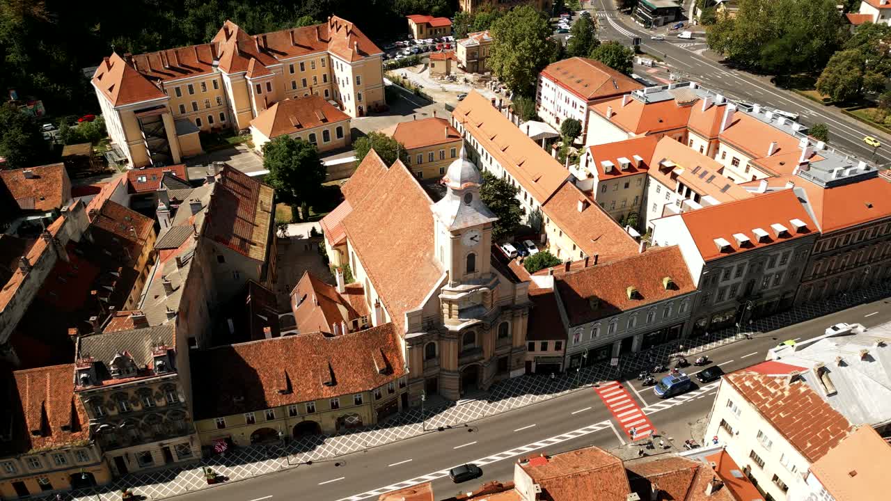 Saints Peter and Paul Church In The Town Of Brassó (Brasov) In Transylvania, Romania. Aerial Rotating Shot