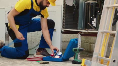 technician maintenancing air conditioner