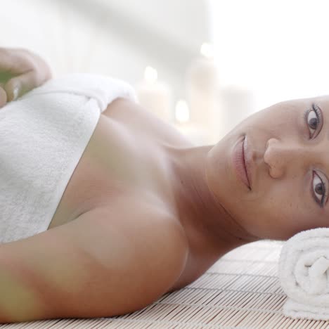 woman lying on a lounger in a wellness center