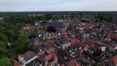 picturesque aerial view of historic dutch city groenlo with church tower rising above the authentic medieval rooftops on an overcast day