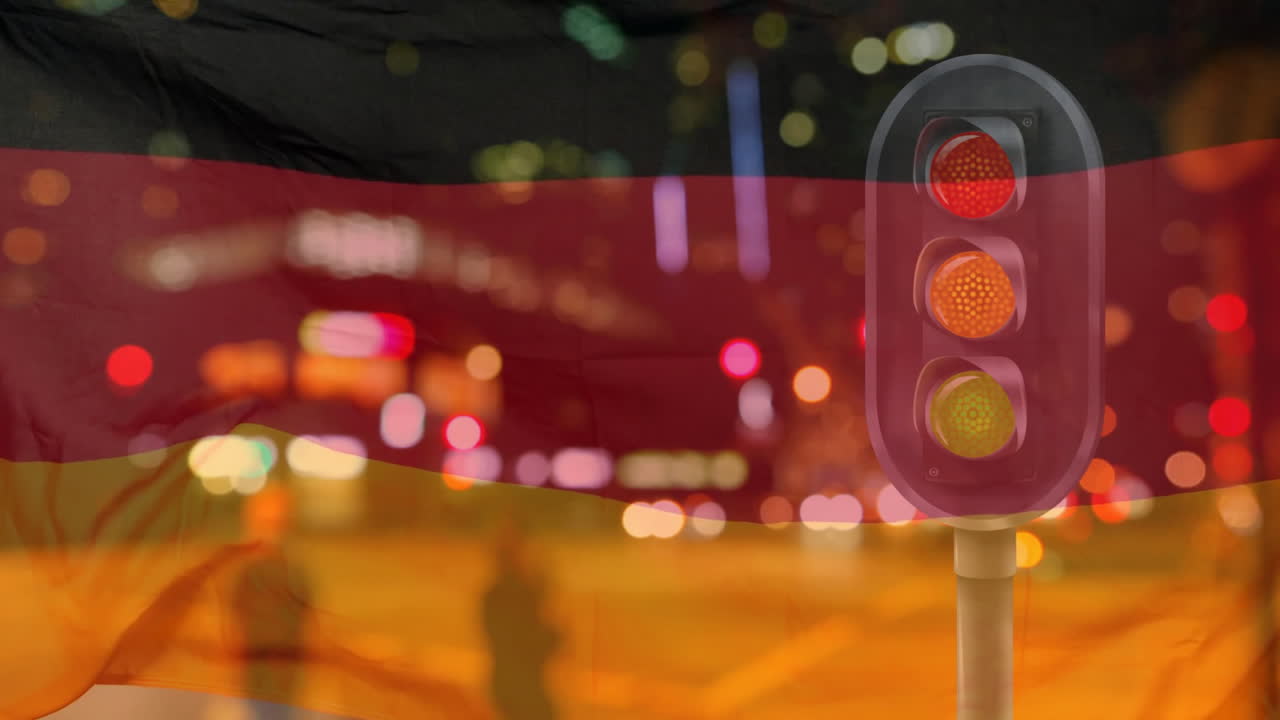 German flag animation over traffic lights and city street at night