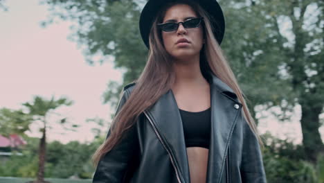 young girl model wearing sunglasses and looking at camera