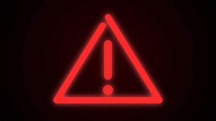 Glowing Red Warning Triangle Symbol Appearing on Dark Background
