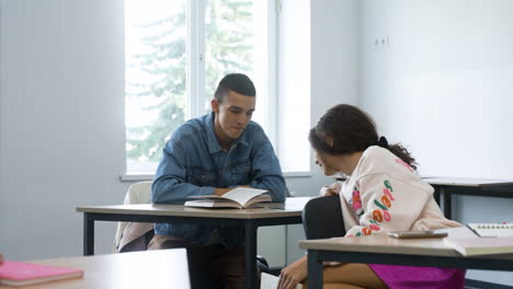 two friends talking in class