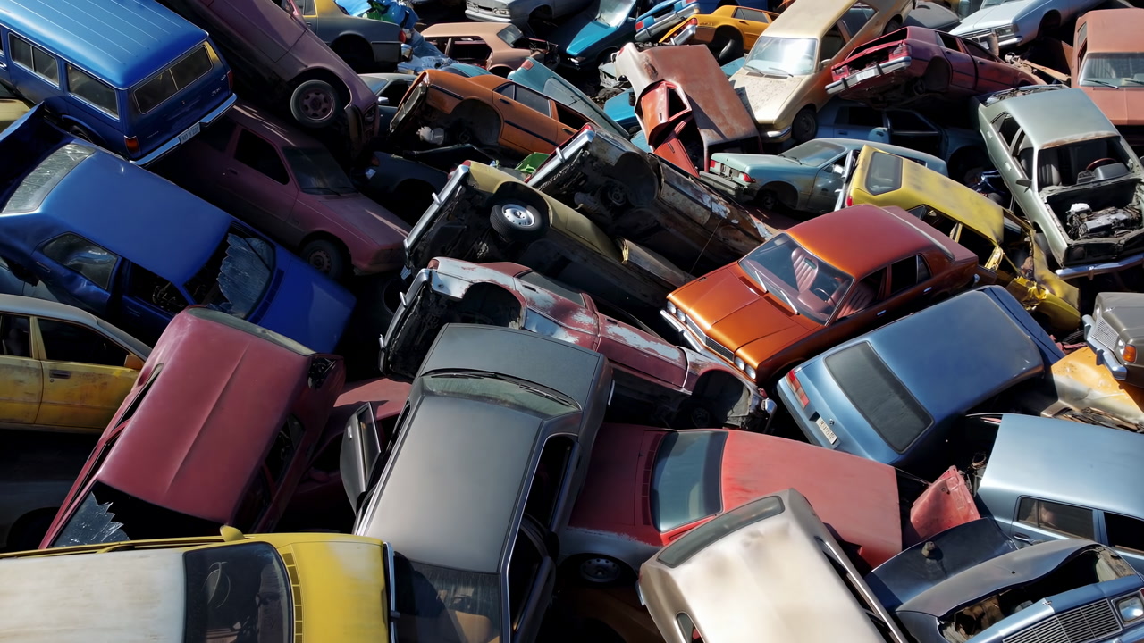 Stacked Rusted Cars Salvage Yard, Collapsed Hoods And Crushed Roofs, Mixed Paint And Tangled Metal, Tow Crew