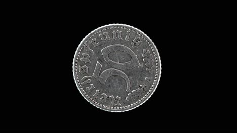 germany 50 reichspfennig 1940 reverse with denomination and oak leaves macro loop on black background