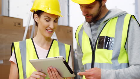 warehouse worker using a tablet