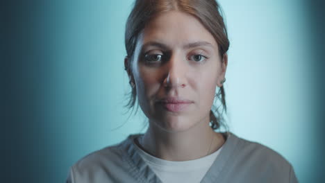 portrait of female doctor on blue background