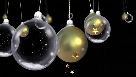 animation of christmas baubles dangling with snow falling and stars on black background