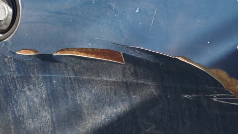 damaged car body with rust