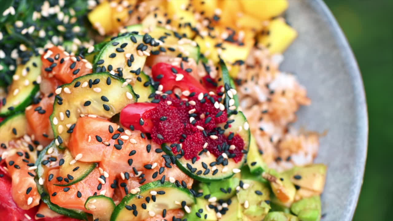 Poke with vegetables, seeds and seafood in a bowl