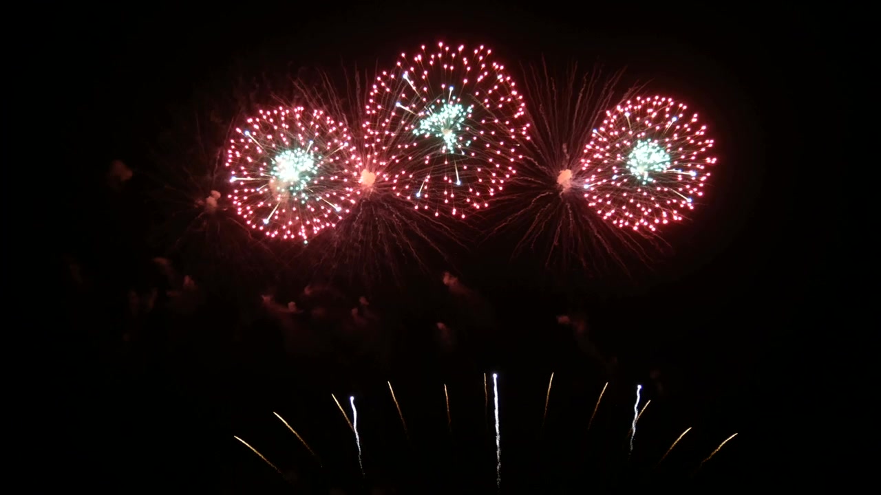 4K. seamless looping of real fireworks background during new year's eve countdown celebration, real colorful shining big fireworks festival in the sky display at night. glowing fireworks show.