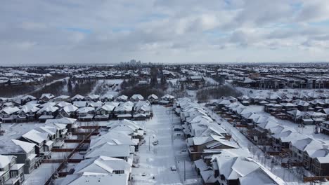 Aerial-view-of-a-suburban-community-in-Calgary,-Alberta-in-winter