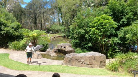 young child runs joyfully in a scenic garden