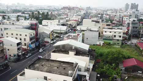 Drone-Aerial-View-of-Suburbia-and-Street-Traffic-in-Tainan-City,-Old-Capital-of-Taiwan