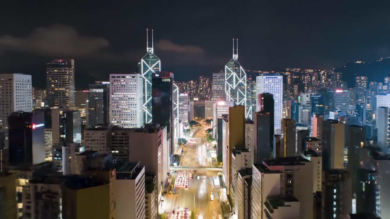 Experience the energy of Hong Kong at night as the skyline shines brightly. Observe the busy streets teeming with life under a starry sky. Enjoy stunning architectural views from above.