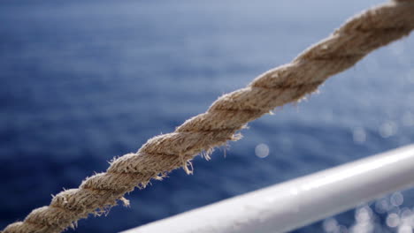 gimbal shot of ocean vibes in ferry way to malta, rope in foreground