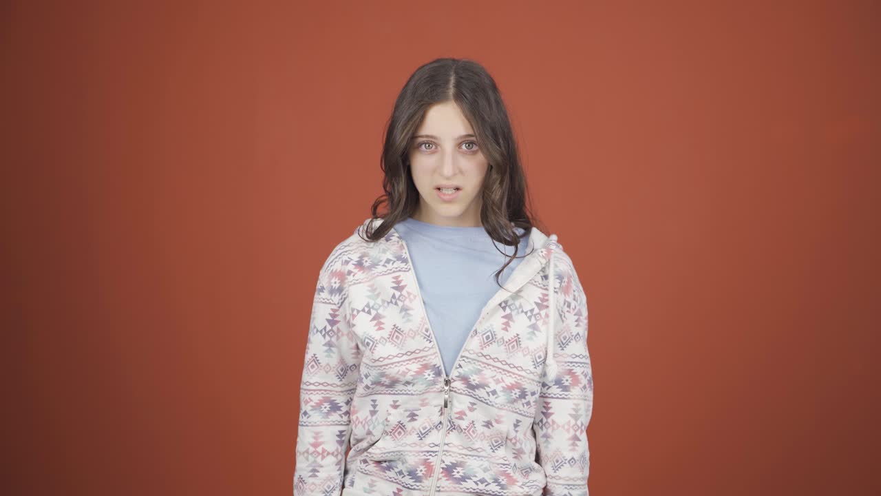 Young woman getting angry at camera.