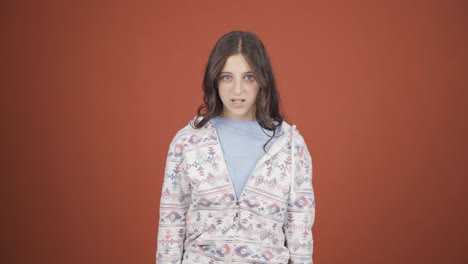 young woman getting angry at camera.