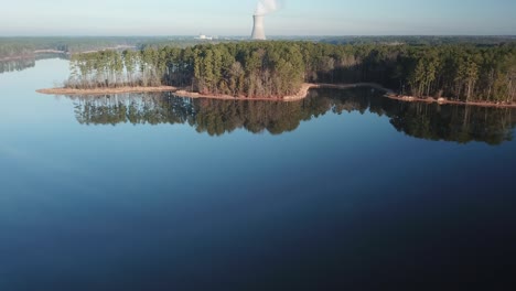 Early-morning-flight-over-Harris-lake-with-mirror-like-reflection-on-the-water-surface