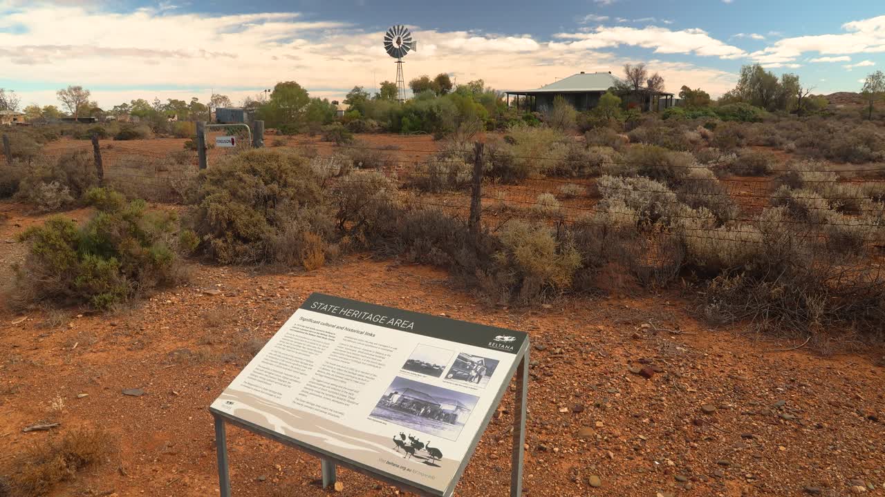 Experience the timeless beauty of Beltana, a State Heritage Area in the vast South Australian Outback. Features a historical windmill and arid landscape, perfect for travel and documentary projects.
